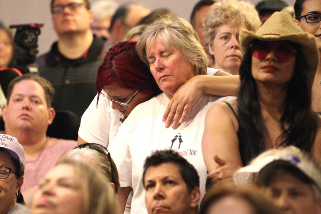 Audience members come to give support during the candle light vigil honoring victims of the Orlando mass shooting at the The Gay and Lesbian Community Center of Southern Nevada on Sunday, June 12, ...