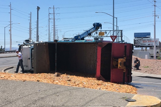A semitrailer overturned near Sahara Avenue and Northbridge Street on Monday, June 6, 2016. The truck was full of feed headed to the pig farm near North Las Vegas. (Bizuayehu Tesfaye/Las Vegas Rev ...