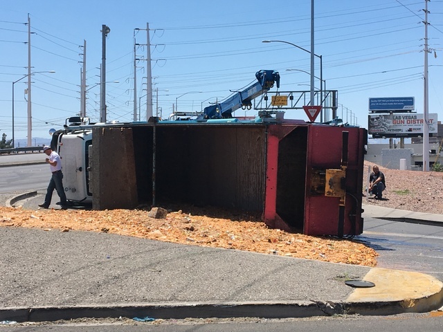 A semitrailer overturned near Sahara Avenue and Northbridge Street on Monday, June 6, 2016. The truck was full of feed headed to the pig farm near North Las Vegas. (Bizuayehu Tesfaye/Las Vegas Rev ...