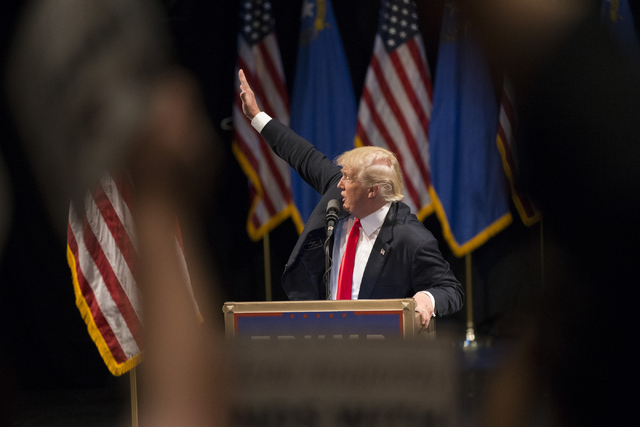 Republican presidential candidate Donald Trump waves at supporters during a campaign rally at the Treasure Island hotel-casino on Saturday, June 18, 2016, in Las Vegas. Erik Verduzco/Las Vegas Rev ...