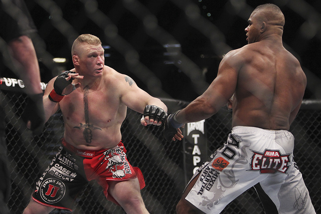 Brock Lesnar, on left, takes on Alistair Overeem during UFC 141 in the MGM Grand Garden Arena in Las Vegas on Dec. 30, 2011. (Jason Bean/Las Vegas Review-Journal)