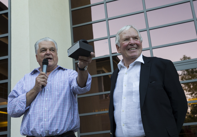 Bill Foley, right, owner of Las Vegas' NHL expansion team, and Clark County Commission Chairman Steve Sisolak, speak at a party to celebrate the state's first major league sports franchise, June 2 ...