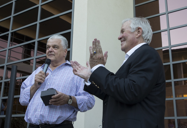 Bill Foley, right, owner of Las Vegas' NHL expansion team, with Clark County Commission Chairman Steve Sisolak, speaks at a party to celebrate the state's first major league sports franchise, June ...