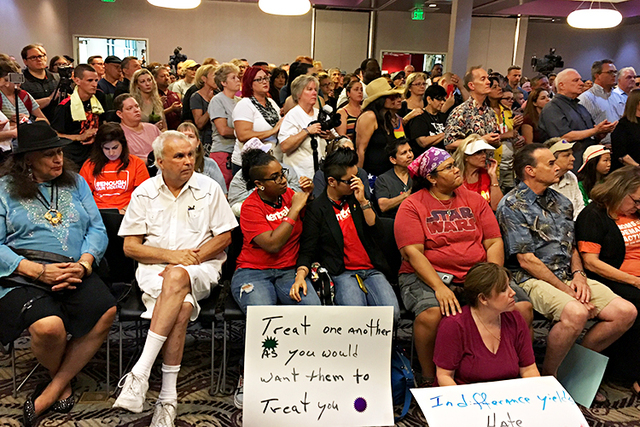 People watch speakers at the vigil being held at The Gay and Lesbian Community Center in Las Vegas to honor the victims of the Orlando mass shooting. (Loren Townsley,/Las Vegas Review-Journal)