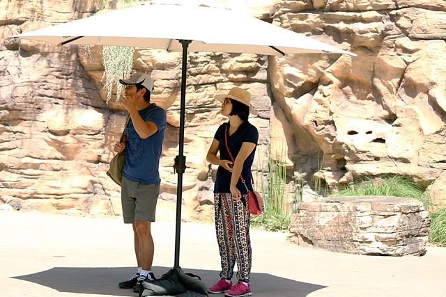 Te Li, left, and Kayee Leung, both of Santa Barbara, Calif., stand under patio umbrella as they visit Las Vegas Springs Preserve on June 7, 2016. (Bizuayehu Tesfaye/Las Vegas Review-Journal Follo ...