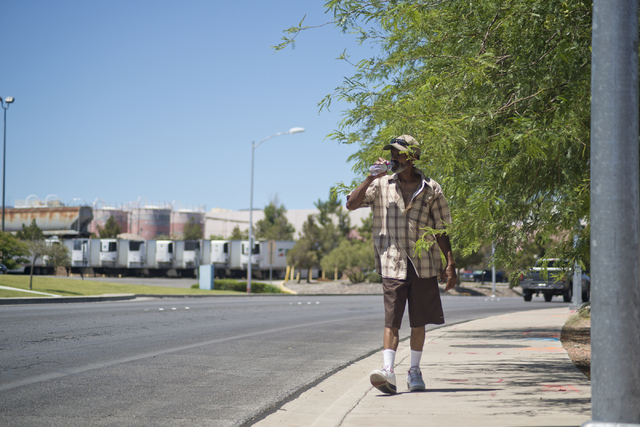 Butch Johnson takes a drink of water while walking on Horizon Drive in Henderson on Friday, June 17, 2016. (Daniel Clark/Las Vegas Review-Journal) Follow @DanJClarkPhoto