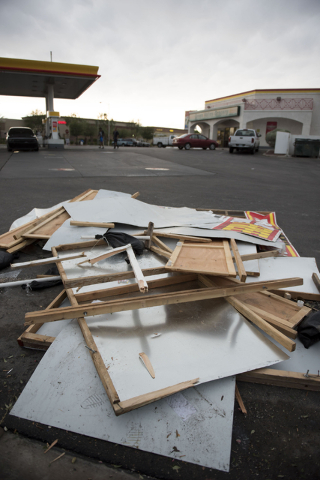 Debris from a fireworks stand which collapsed due to the storm sits in the Shell gasoline station parking lot on Blue Diamond Road at Valley View Boulevard in Las Vegas Thursday, June 30, 2016. Ja ...