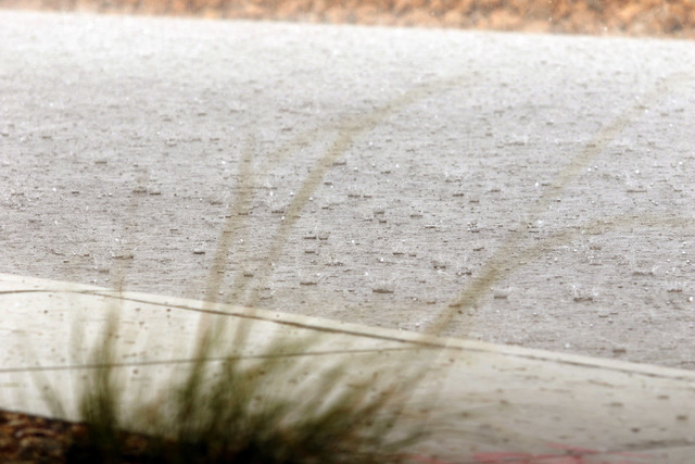 Rain and hail pound down on Sobb Avenue near Southern Hills Hospital, Thursday, June 30, 2016, in southwest Las Vegas. (Ronda Churchill/Las Vegas Review-Journal)