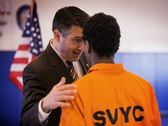 Nevada Gov. Brian Sandoval talks to a juvenile at the Summit View Youth Correctional Center, a 48-bed facility in North Las Vegas, on Friday, Feb. 26, 2016. (Jeff Scheid/Las Vegas Review-Journal ...