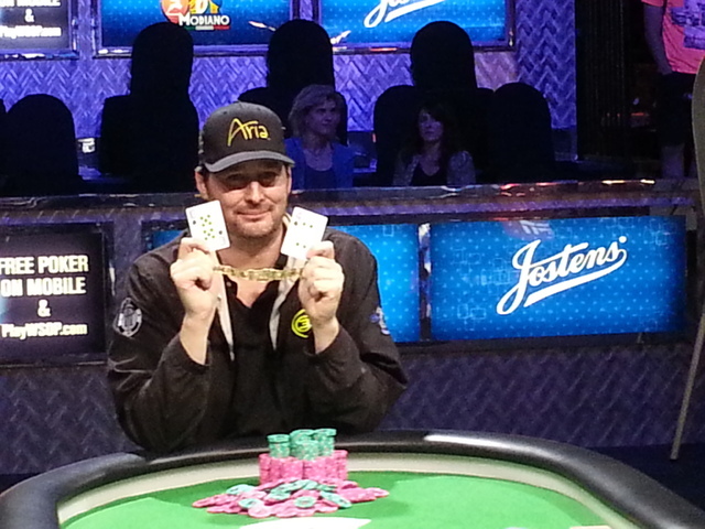 Phil Hellmuth poses with the 10 and 4 of spades to represent his 14th career World Series of Poker bracelet. Hellmuth, the all-time record holder, won the $10,000 buy-in Razz Championship late Mon ...