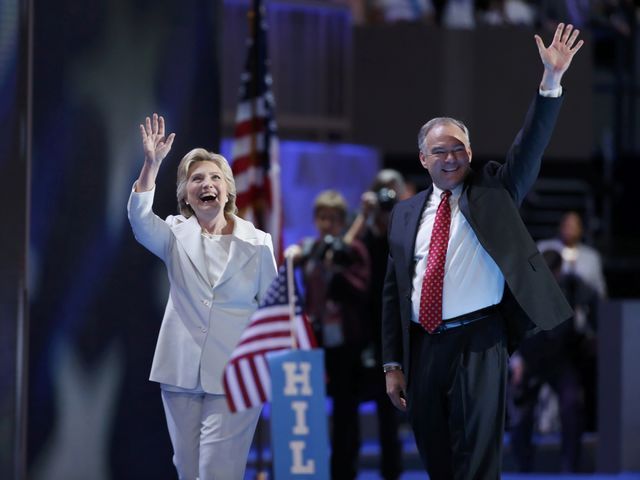 Hillary Clinton waves with her vice-presidential running mate, U.S. Sen. Tim Kaine, after accepting the nomination on the fourth and final night at the Democratic National Convention in Philadelph ...
