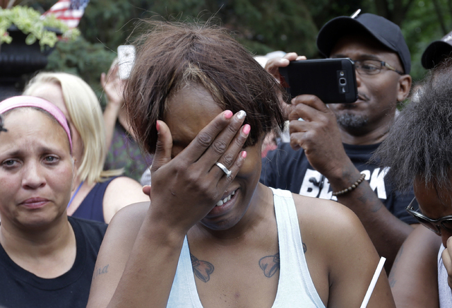 Diamond Reynolds, the girlfriend of Philando Castile of St. Paul, cries outside the governor's residence in St. Paul, Minn., on Thursday, July 7, 2016.   (Jim Mone/AP)
