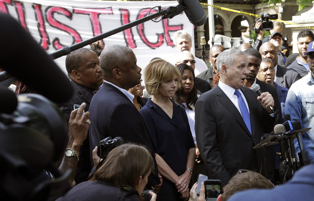 Minnesota Gov. Mark Dayton, right, speak to protesters and media outside the governor's residence Thursday, July 7, 2016, in St. Paul, Minn., after a police officer fatally shot Philando Castile. ...