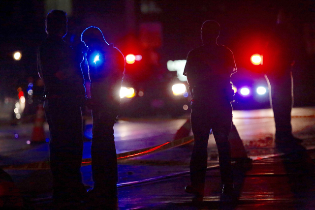 Investigators work at the scene of a police involved shooting with St. Anthony Police officers on Wednesday, July 6, 2016, in Falcon Heights, Minn. Police in Minnesota say a man has died after bei ...