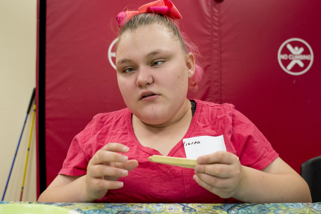 Hayley Jordan, 16, holds a handful of popsicle sticks during arts and crafts time at Nevada Blind Children's Foundation Learning Center in Las Vegas June 16. Bridget Bennett/View
