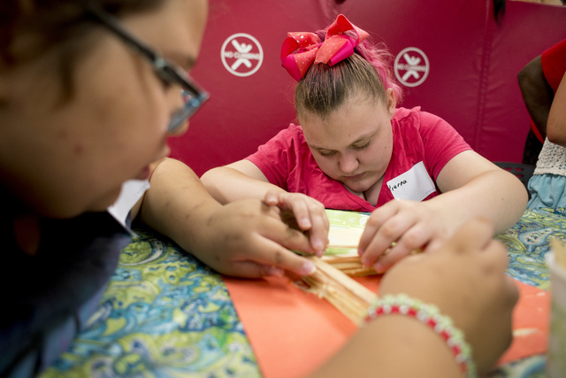 Hayley Jordan, 16, works on building a stick tower during arts and crafts time at Nevada Blind Children's Foundation Learning Center in Las Vegas June 16. Bridget Bennett/View