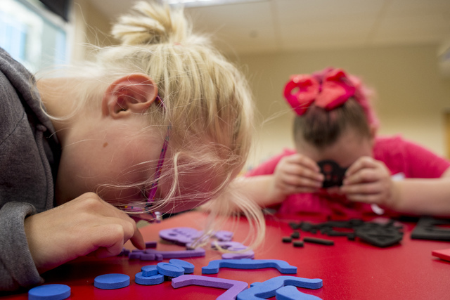 From left, Kristlynn Allison, 9, and Hayley Jordan, 16, build master bugs at Nevada Blind Children's Foundation Learning Center in Las Vegas June 16. Bridget Bennett/View Follow @bridgetkbennett o ...
