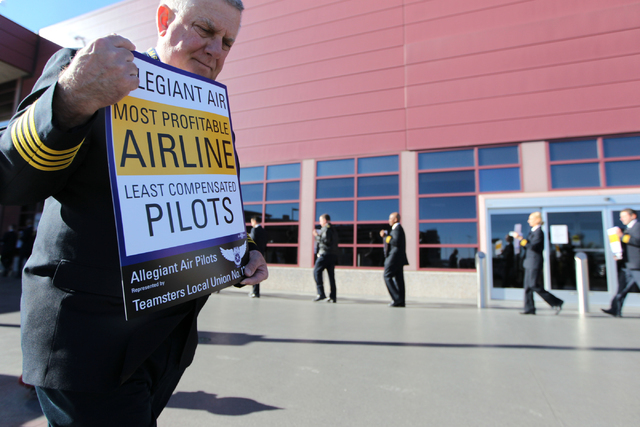 Allegiant air pilots participate in a picket line to call for a better contract at McCarran International Airport Terminal 1 Tuesday, Jan. 13, 2015. Allegiant pilots are represented by the Teamste ...