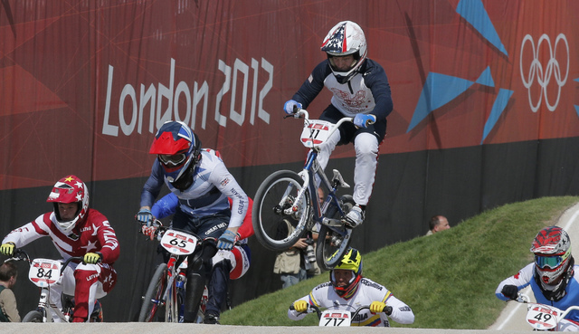 The United States' Connor Fields (11) leads the competition in a BMX cycling men's quarterfinal run during the 2012 Summer Olympics in London, Aug. 9, 2012. Christophe Ena, File/AP)