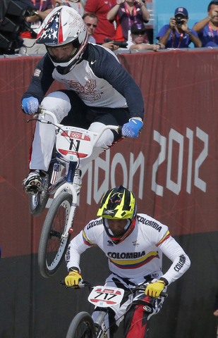 Connor Fields of the United States takes a jump in a BMX cycling men's quarterfinal run during the 2012 Summer Olympics in London, Thursday, Aug. 9, 2012. (Christophe Ena/AP)