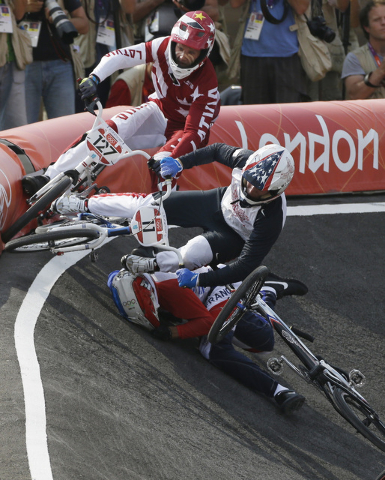 United States' Connor Fields  (11) crashes during a a BMX cycling men's semifinal run during the 2012 Summer Olympics, Aug. 10, 2012, in London. (Matt Rourke/AP)
