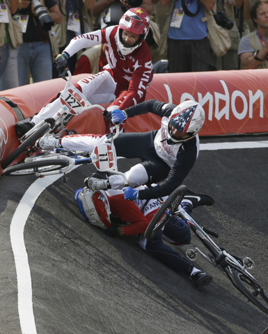 United States' Connor Fields (11) crashes during a a BMX cycling men's semifinal run during the 2012 Summer Olympics, Aug. 10, 2012, in London. (Matt Rourke/AP)