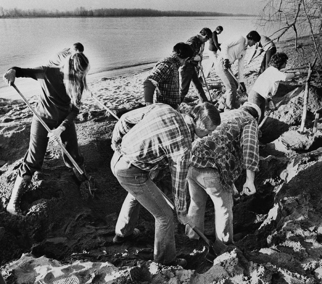 FBI agents scour the sand of a beach on the Columbia River in this Feb. 13, 1980, file photo, searching for additional money or clues in the D.B. Cooper skyjacking case, in Vancouver, Washington.  ...
