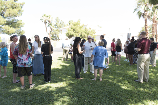 Attendees gather at an outreach event held at Torrey Pines Condominiums following Wednesday night's quadruple murder-suicide of a family in Las Vegas on Saturday, July 2, 2016. Jason Ogulnik/Las V ...