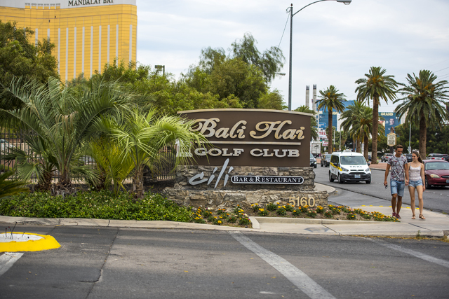 Pedestrians walk by the  Bali Hai Golf Club in Las Vegas on Friday, May 20, 2016. The club is being considered as a location for the proposed NFL stadium. (Joshua Dahl/Las Vegas Review-Journal)