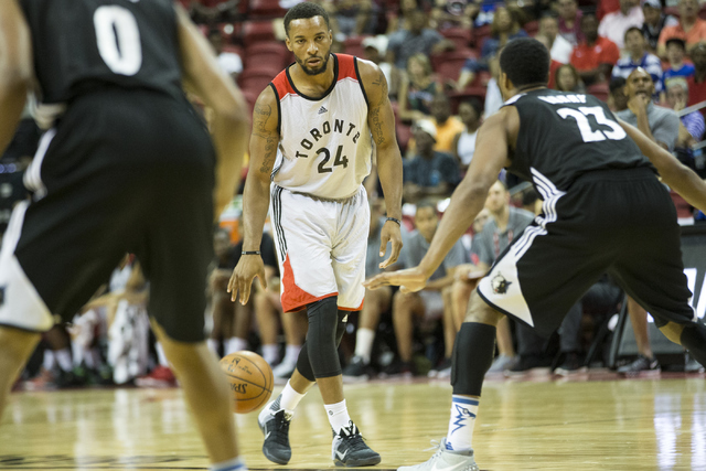Toronto RaptorsՠNorman Powell (24) dribbles the ball on offense against the Minnesota Timberwolves in the NBA Summer League quarterfinal game at the Thomas and Mack Center on Saturday, July 16, 2 ...