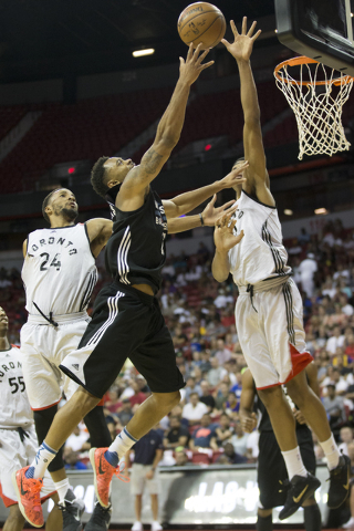 Minnesota Timberwolves’ Xavier Silas (25) goes up for a shot against the Toronto Raptors in the NBA Summer League quarterfinal game at the Thomas & Mack Center on Saturday, July 16, 2016, in ...
