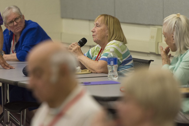 Marilynne Recker, center, directs a question to instructor Howie Sussman after watching a documentary film during the Osher Lifelong Learning Institute class on Winston Churchill at UNLV's Educati ...