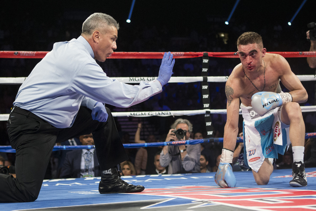 Matias Rueda Gets A Count After Taking A Knee Against Oscar Valdez Jr In The Featherweight Title Bout For The Vacant Wbo World Title At The Mgm Grand Garden Arena On Saturday