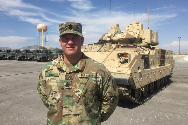 First Sgt. Michael Davis stands in front of one of the Nevada Army National Guard's new Bradley Fighting Vehicles at the Clark County Armory, Thursday, July 28, 2016. (Keith Rogers/Las Vegas Revie ...