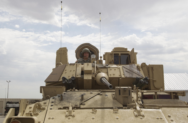 A Nevada National Guard soldier looks through the hatch of an A-3 Bradley fighting vehicle during a training exercise at the Clark County Armory on Friday, July 29, 2016. Richard Brian/Las Vegas R ...