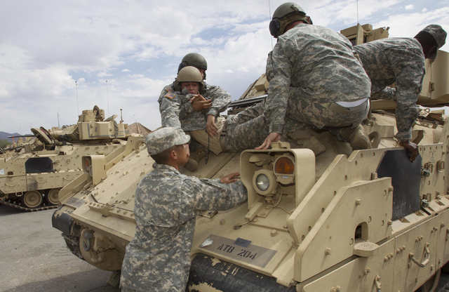 Nevada National Guard soldiers perform a casualty training exercise on the A-3 Bradley fighting vehicles at the Clark County Armory on Friday, July 29, 2016. Richard Brian/Las Vegas Review-Journal ...