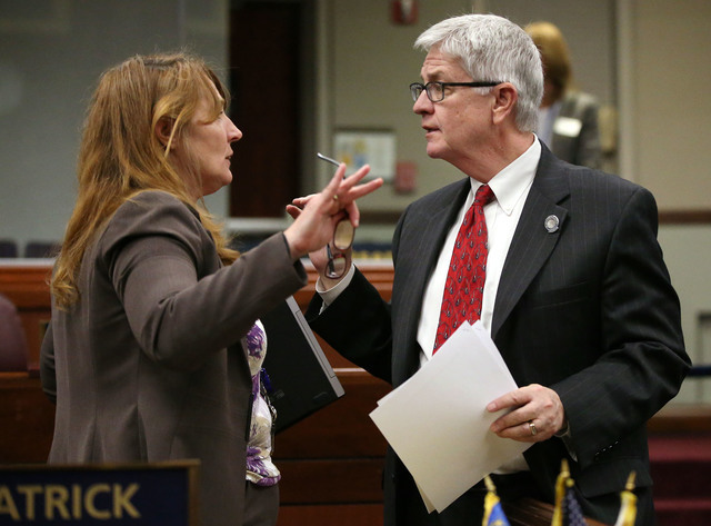 Nevada Assembly Minority Leader Marilyn Kirkpatrick, D-North Las Vegas, talks with Assemblyman Erven Nelson, R-Las Vegas, talk on the Assembly floor following a floor debate over a measure that wi ...