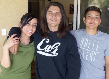 Robert Bustos II, center, with family, as seen in a photo posted to GoFundMe page set up to raise money for funeral expenses on July 12, 2016.