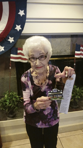 Winifred “Winnie” Garvin, a resident of Prestige Senior Living at Mira Loma in Henderson shows her Cracker Barrel Christmas ornament she purchased at an Indianapolis location. (Courtesy)