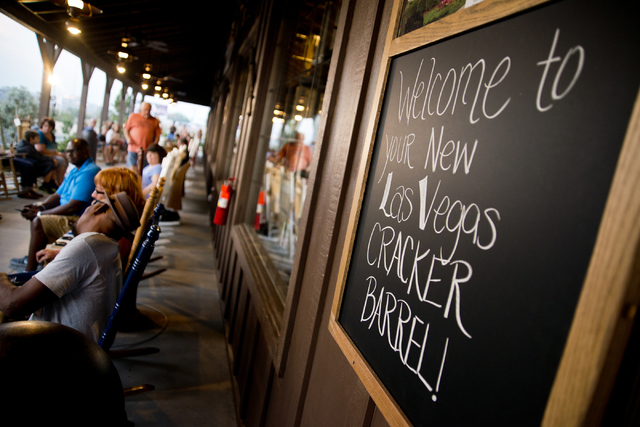 A sign greets early-bird customers during the grand opening of Las Vegas' first Cracker Barrel location near the Silverton Hotel-Casino on Monday, July 25, 2016. The line to get in stretched into ...