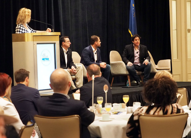 Moderator Shane Tews listens as panelists Michael Kaczmarek, Scott McCormick and Ian C. Ballon, left to right, discuss cyber security details with business owners at a breakfast meeting sponsored ...