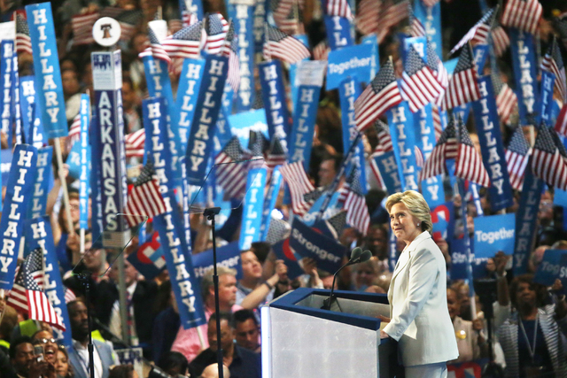 Democratic presidential nominee Hillary Clinton looks into the crowd while presenting her speech during the final day of the Democratic National Convention at the Wells Fargo Center on Thursday, J ...