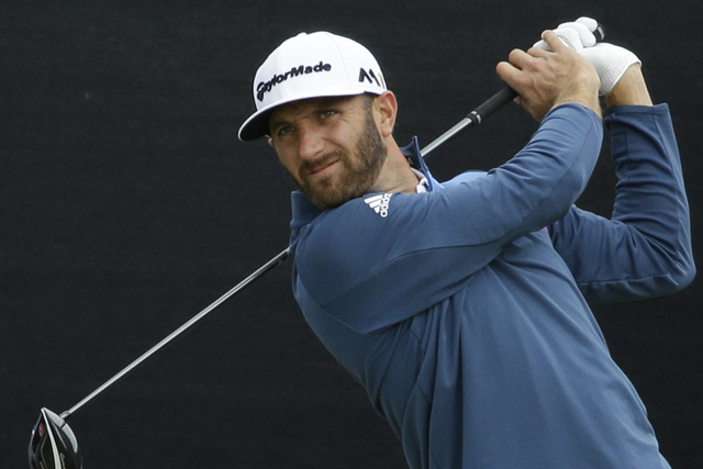 Dustin Johnson of the US plays his tee shot off the 1st during a practice round ahead of the British Open Golf Championships at the Royal Troon Golf Club in Troon, Scotland, Tuesday, July 12, 2016 ...