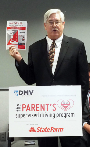 Nevada Department of Motor Vehicles public information officer Kevin Malone holds up a pamphlet as the Nevada DMV unveils a new program, The Parent's Supervised Driving Program, that will help par ...