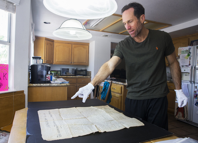 Kevin Kostiner discusses the dye used to print the second-generation copy of the Declaration of Independence he found in a box of documents purchased at an online auction on Wednesday, June 22, 20 ...