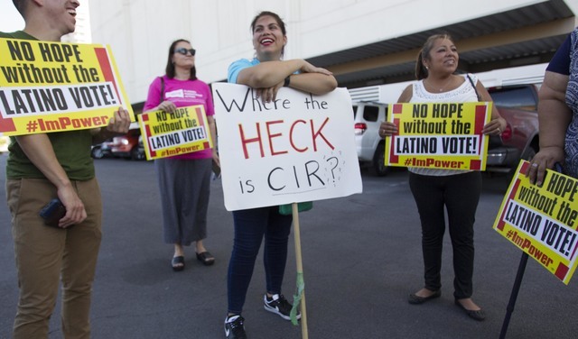 Protesters wait for U.S. Rep. Joe Heck, R-Nev., at a breakfast meeting hosted by the non-partisan organization Hispanics In Politics. (Richard Brian/Las Vegas Review-Journal) Follow @vegasphotograph