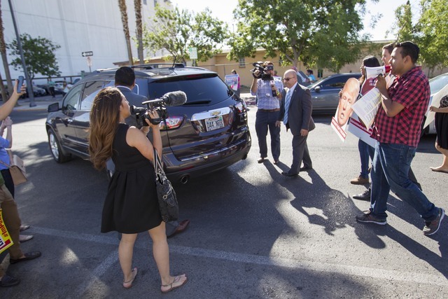 Protesters heckle U.S. Representative U.S. Rep. Joe Heck, R-Nev., as he drives away following a breakfast meeting hosted by the non-partisan organization Hispanics In Politics. (Richard Brian/Las  ...