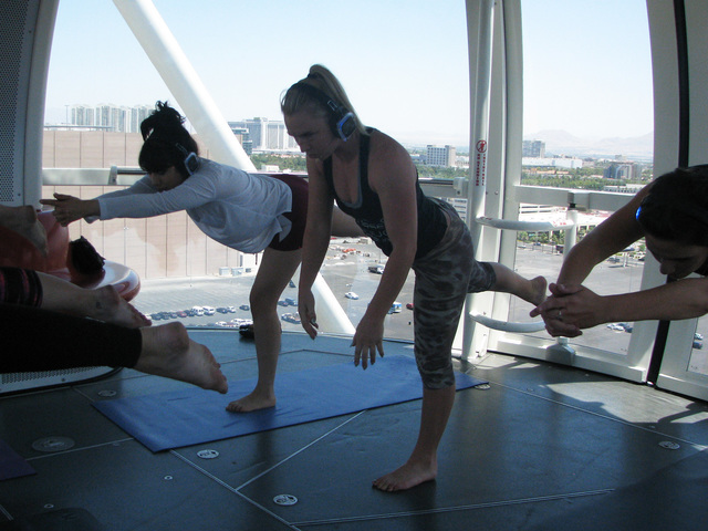 Paricipants take a Silent Savasana class on the High Roller at the Linq June 22. F. Andrew Taylor/View