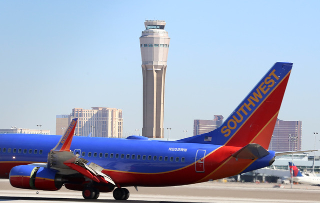 The new air traffic control tower at McCarran airport is seen as a Southwest Airlines jet lands on Thursday, July 7, 20176. Bizuayehu Tesfaye/Las Vegas Review-Journal Follow @bizutesfaye