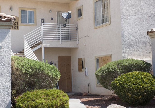 A unit is boarded up at Torrey Pines Condominiums in Las Vegas on Thursday, June 30, 2016. Neighbors said the unit is where three children were found shot dead Wednesday night. Police said Jason D ...